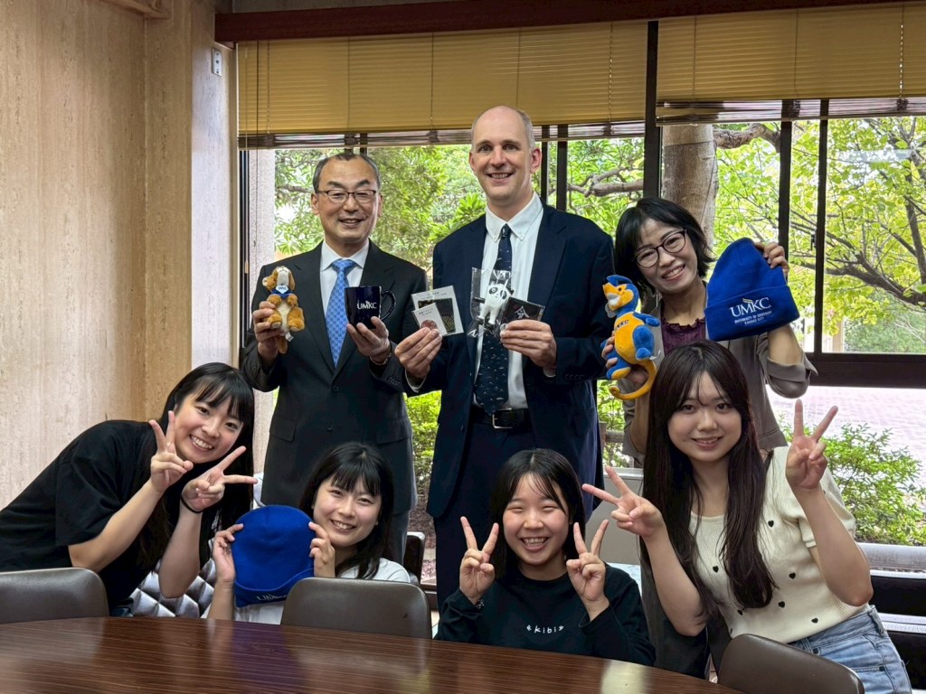 Group smiling and making peace signs