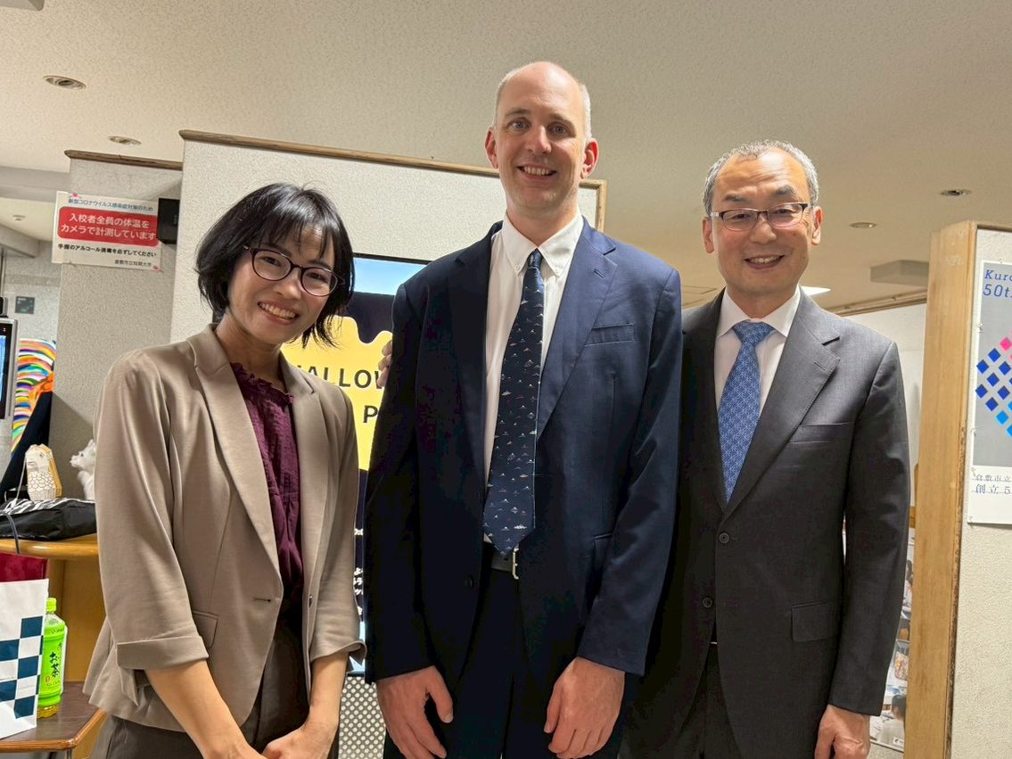 Group shaking hands and smiling