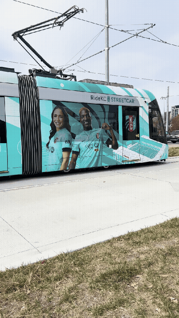 GIFs of moving Kansas City streetcars in the daytime and nighttime.