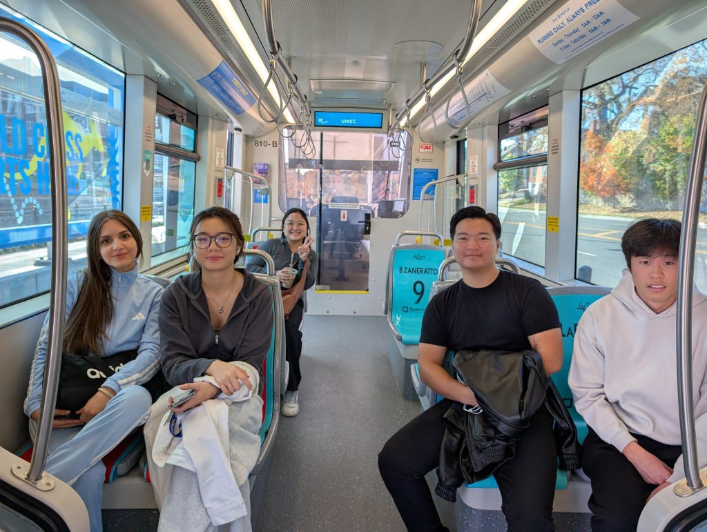 Smiling students on the streetcar