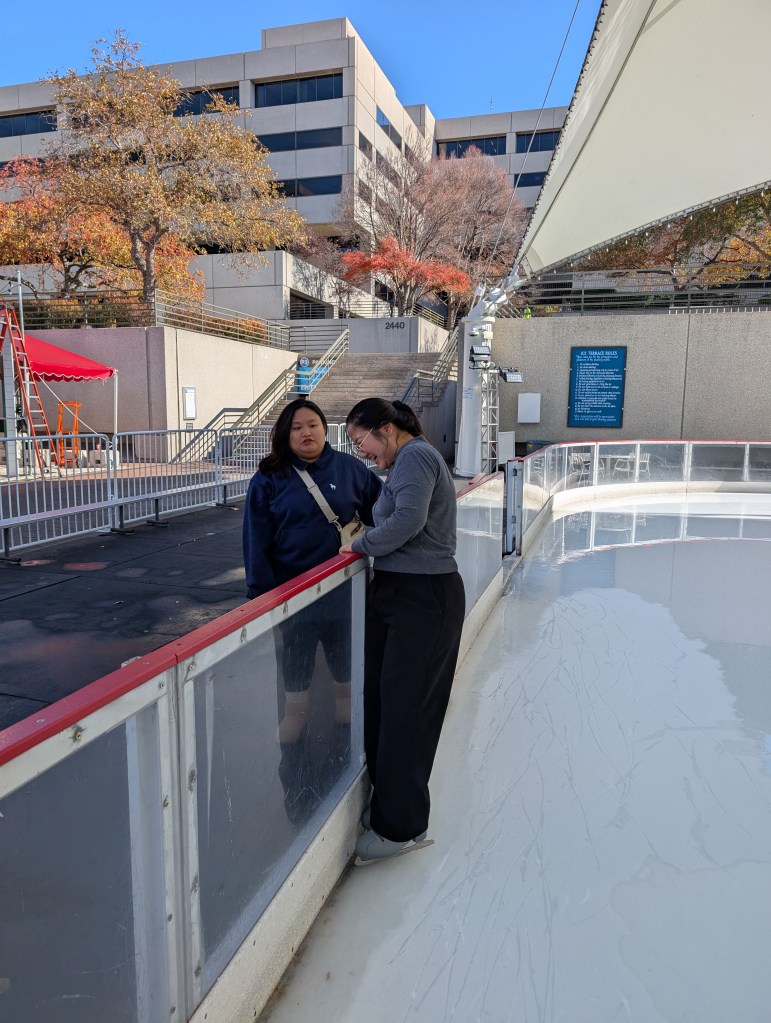 Students laughing on the ice rink
