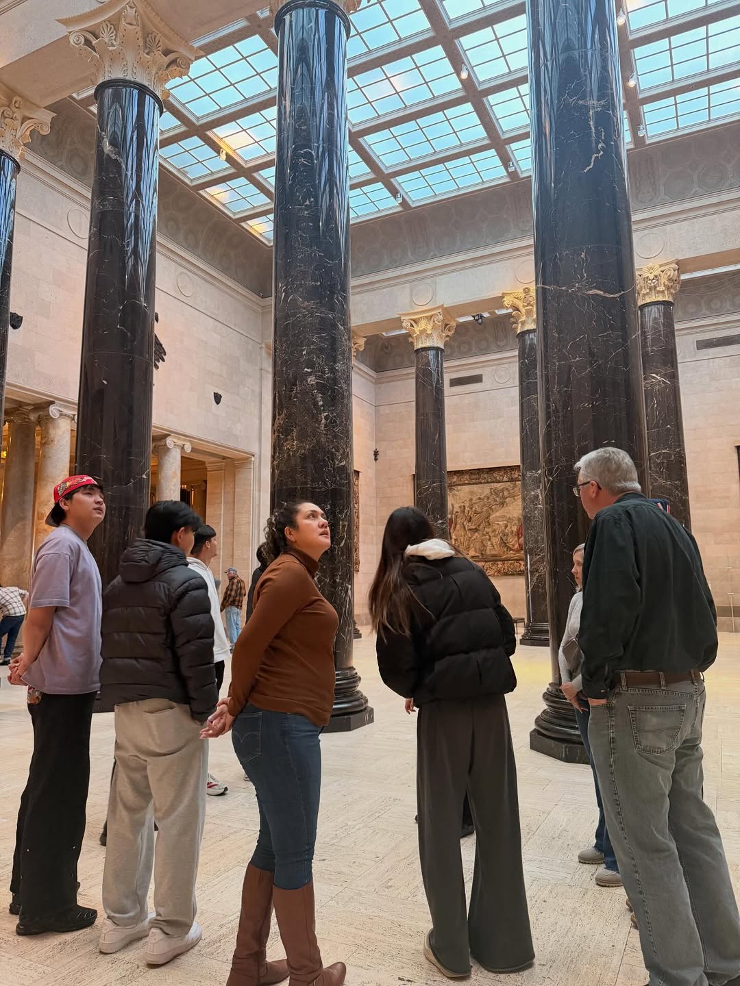Students looking at art in museum