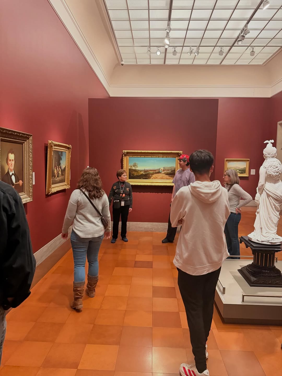 Students looking at art in museum