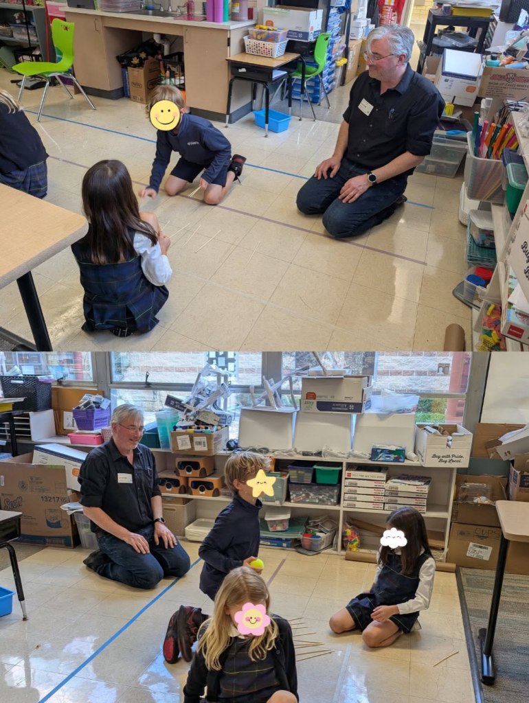 Kids and adults squatting on the floor, engaged in an activity.