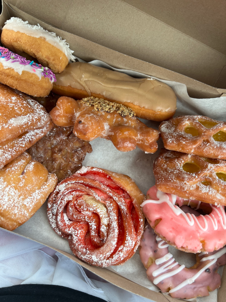 Box full of colorful donuts.