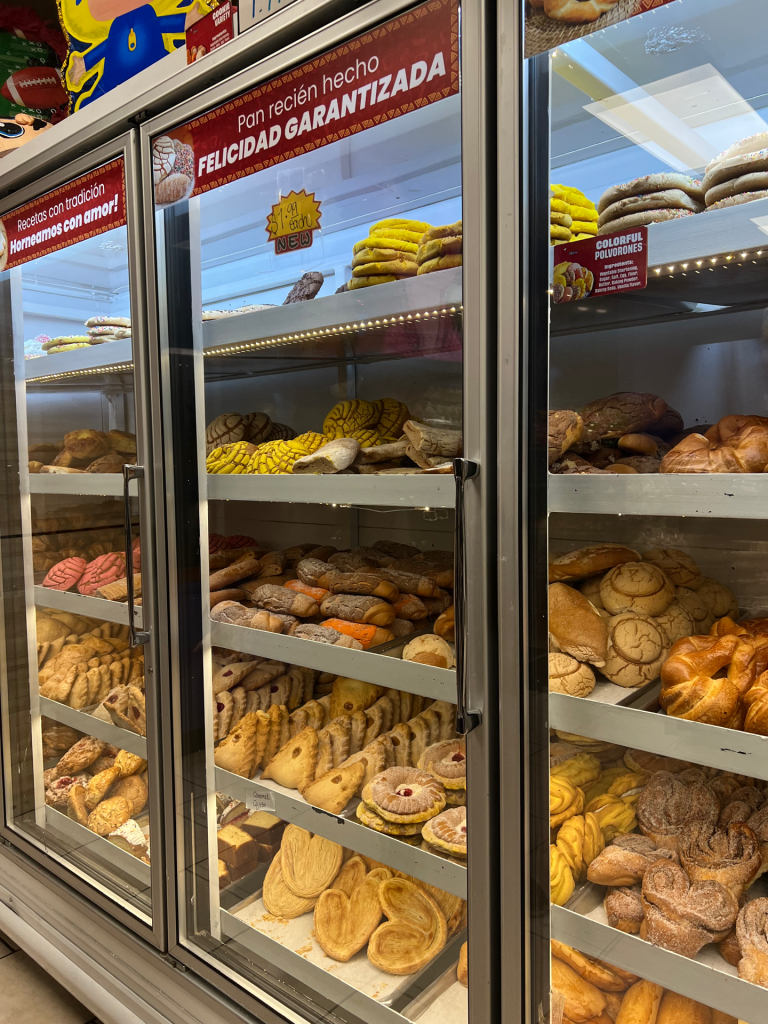 Image of self-serve bakery shelves full of pastries.